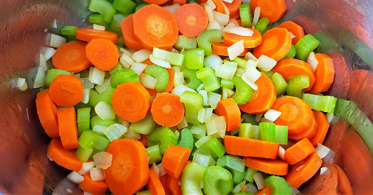 Carrots, celery and onion being cooked in Instant Pot.