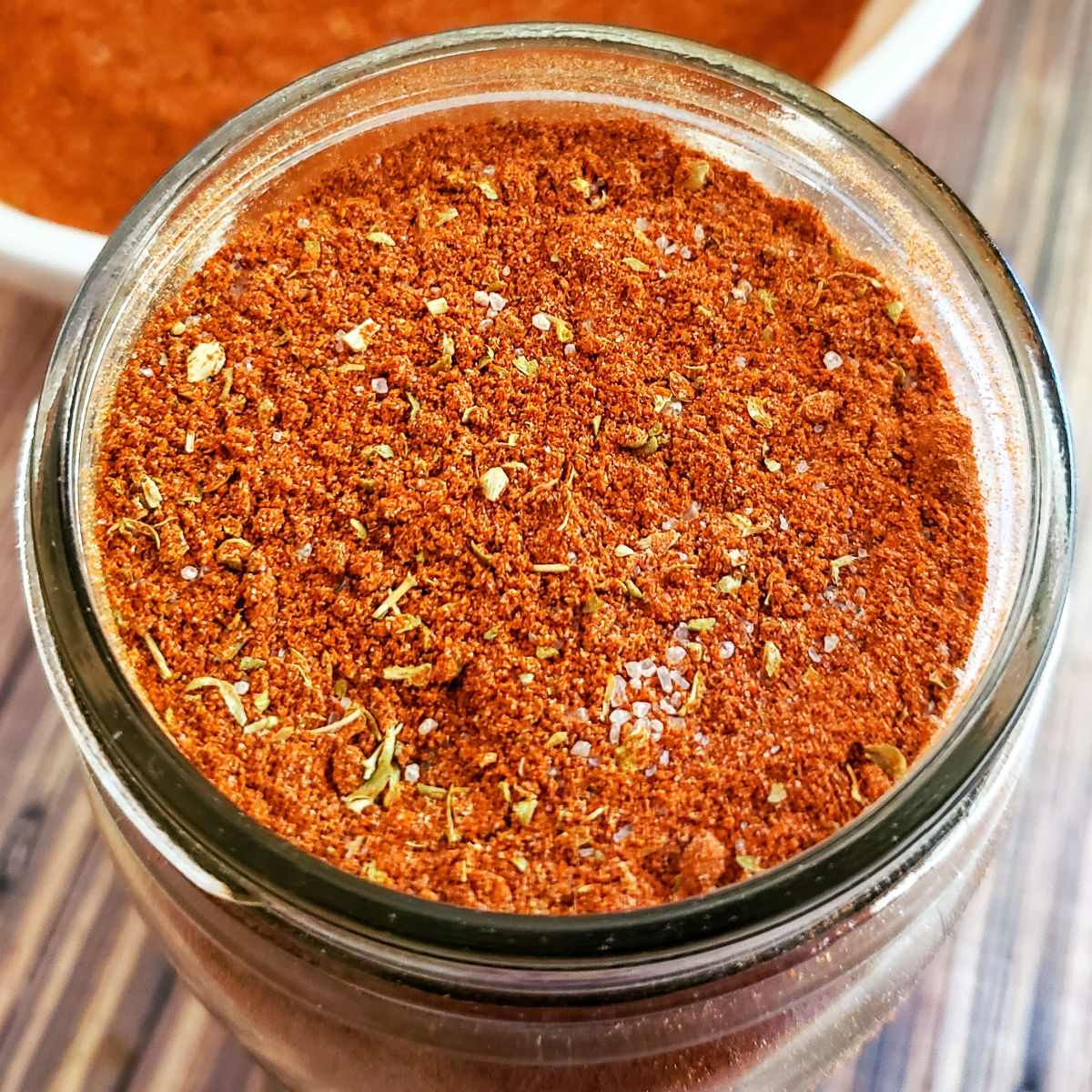 Overhead view of paprika chicken spice mix in mason jar