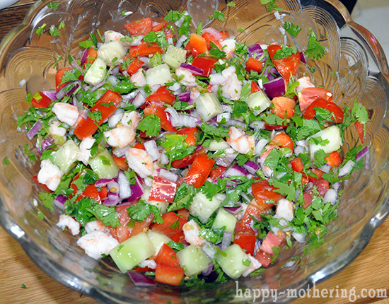 Ingredients for shrimp ceviche in a glass bowl