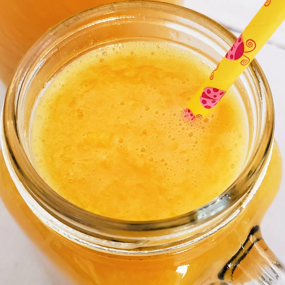 Glass of homemade fermented orange juice.