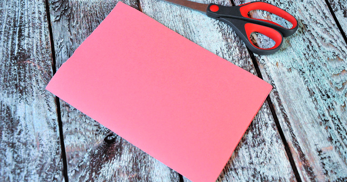 Pink construction paper folded in half