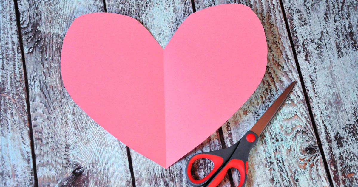 Heart cut out of pink construction paper