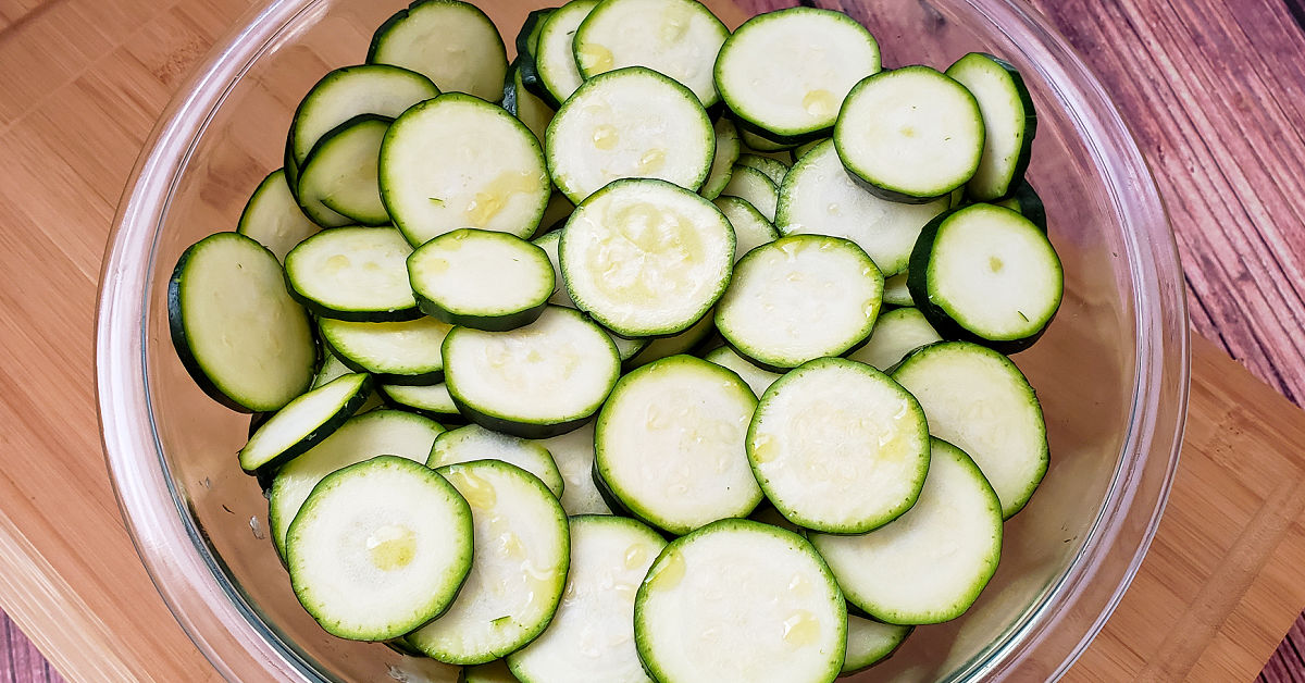Zucchini slices lightly coated in olive oil.