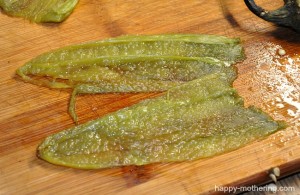 Roasted hatch chiles on a cutting board