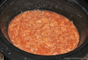 Mashed apples in slow cooker for apple butter