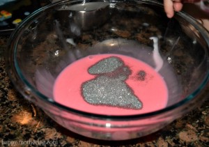 Glitter being added to pink slime mixture