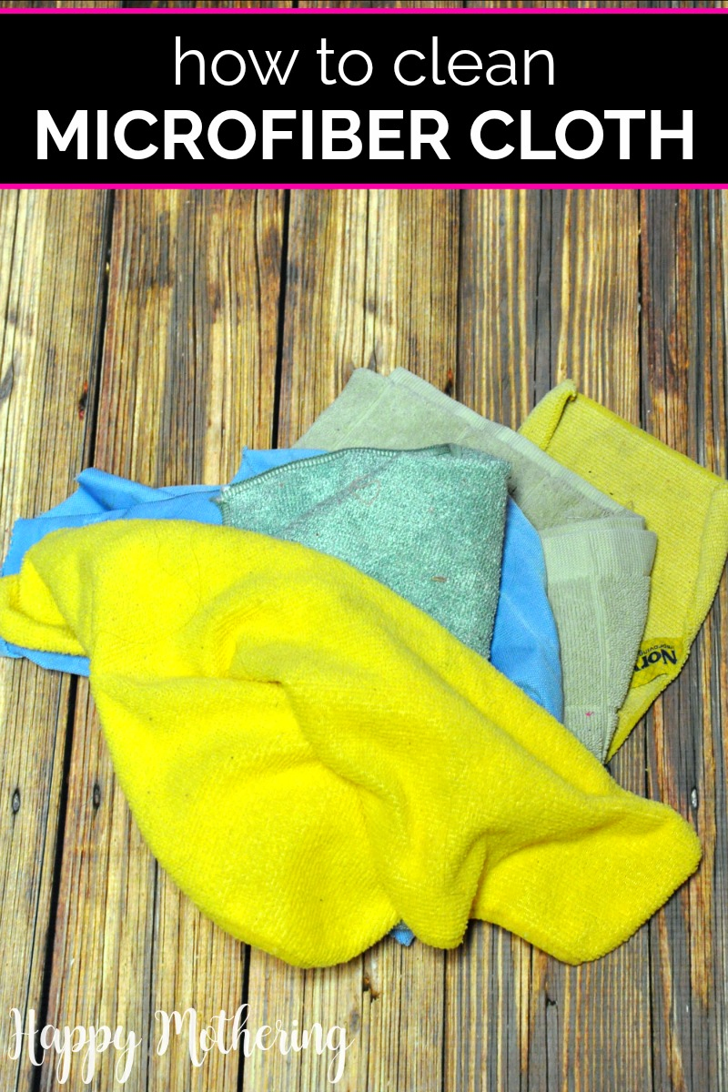Five microfiber cleaning cloths on a wood table