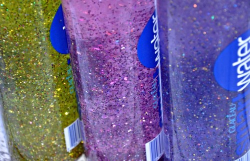 Close up of three homemade glitter meditation time out bottles