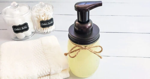 Homemade foaming hand soap with wash cloths, qtips and cotton balls.