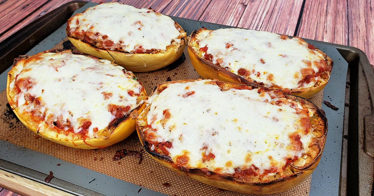 Bubbly melted mozzarella cheese on lasagna spaghetti squash boats.