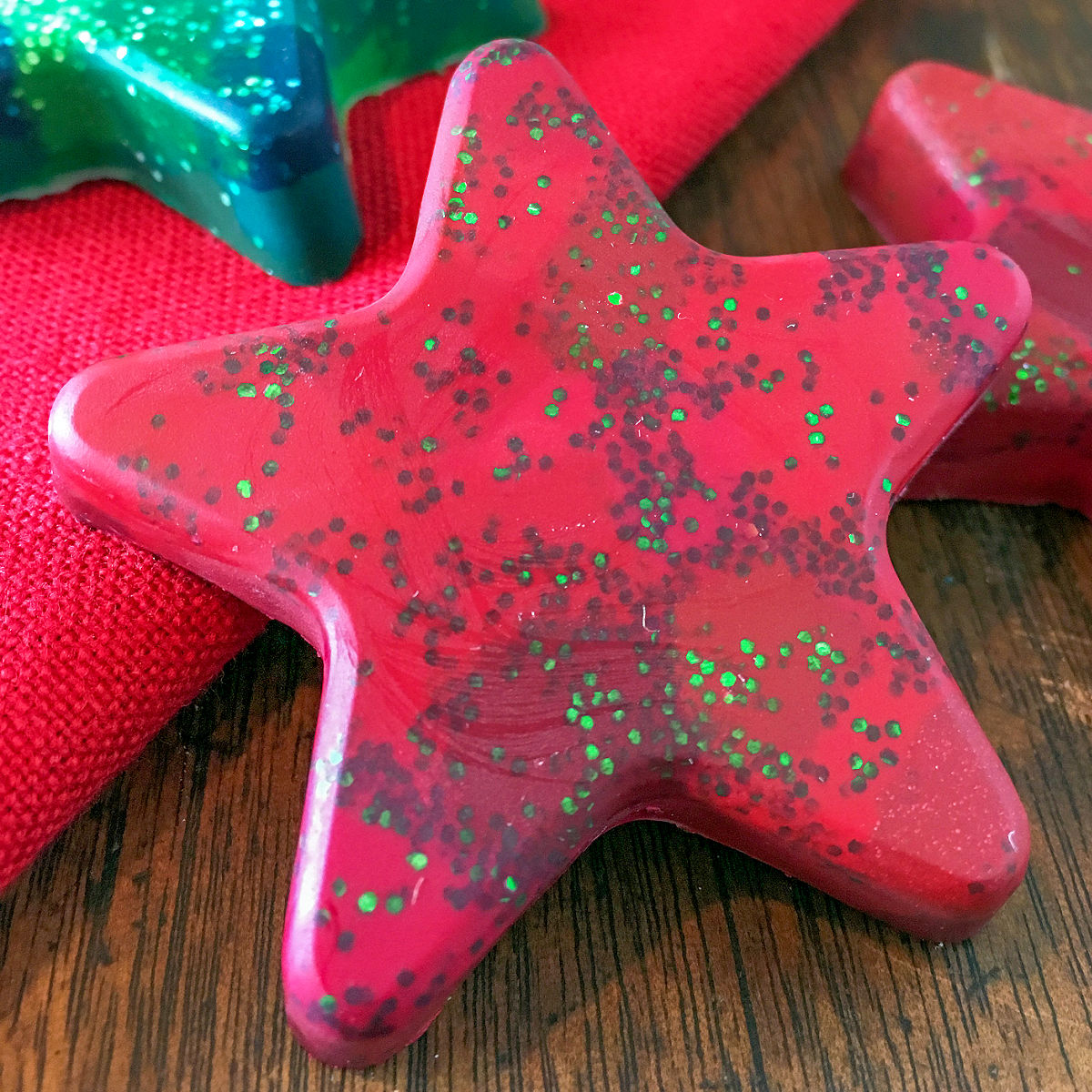 Homemade red star glitter crayon made from melted crayons.