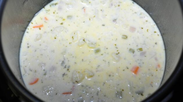 Chunks of cooked veggies in cauliflower soup that will need to be broken down or pureed