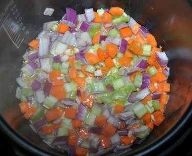 Sauteeing carrots, onions, celery and garlic in a pressure cooker