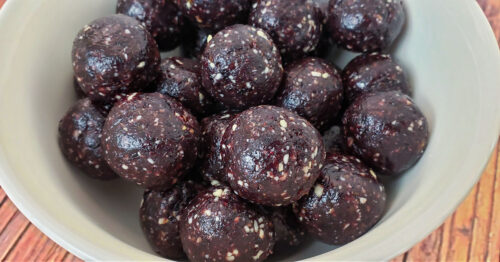 Blueberry Cashew Date Energy Balls in a white bowl.