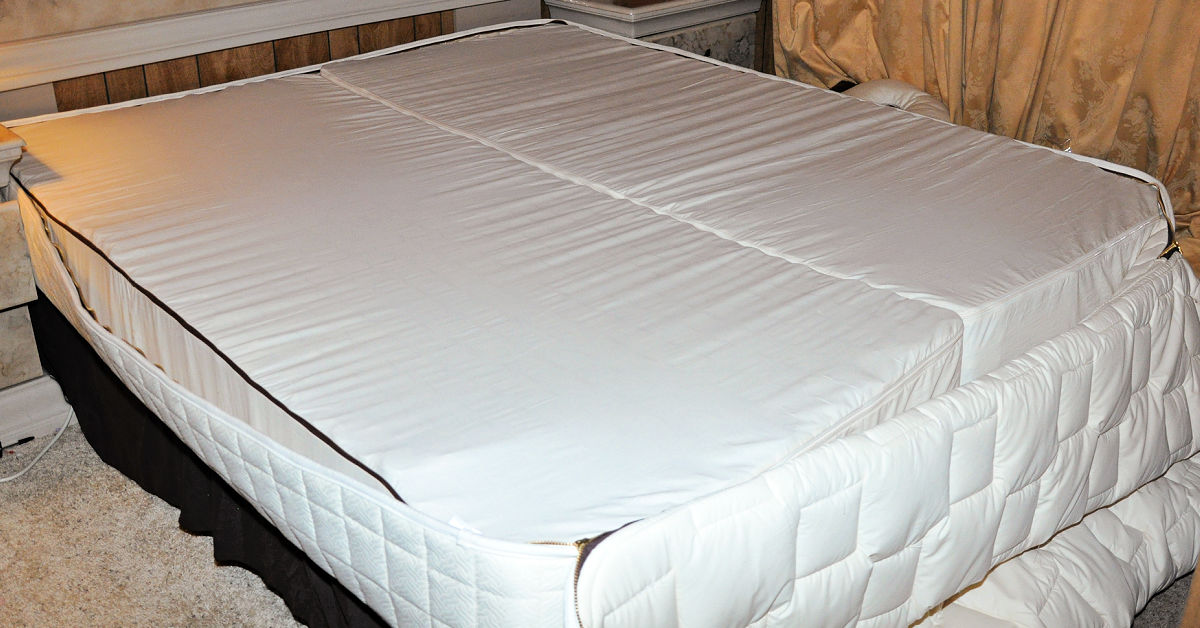 Both layers of the naturepedic bed are unrolled side by side and ready to have the next layer laid on top of them