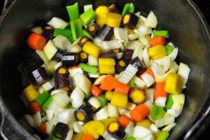 Rainbow carrots in the bottom of a cast iron dutch oven