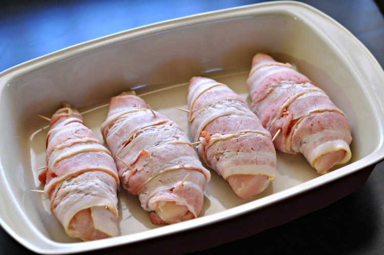Jalapeno popped stuffed chicken breasts wrapped in raw bacon in casserole pan