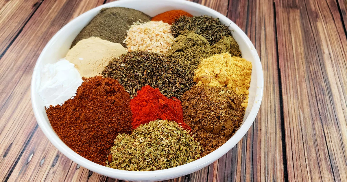 Bowl of dried spices and seasonings to make homemade cajun seasoning