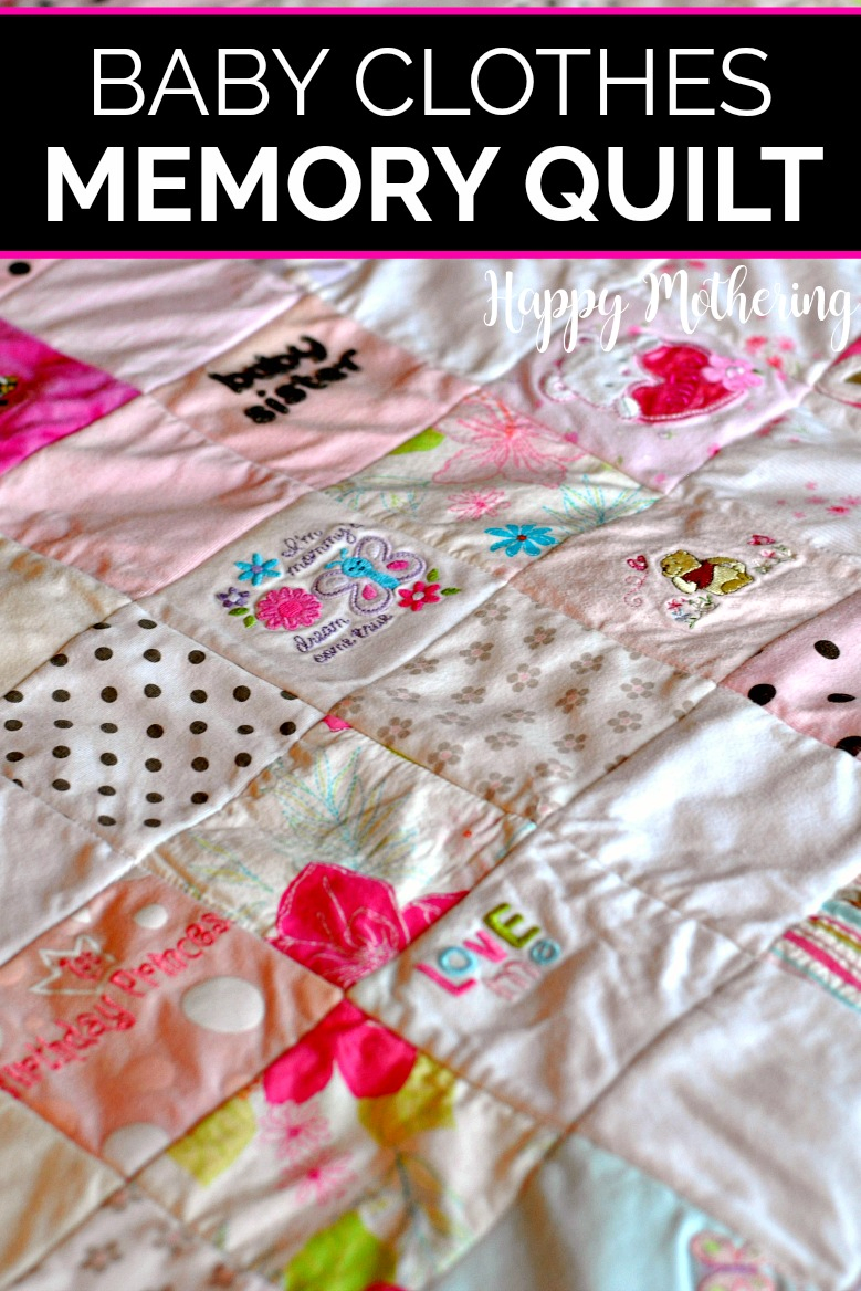Memory quilt made from baby clothes spread out on the bed so you can see each square