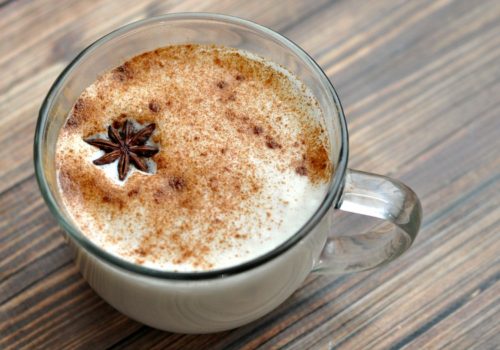 Chai latte in a clear glass mug