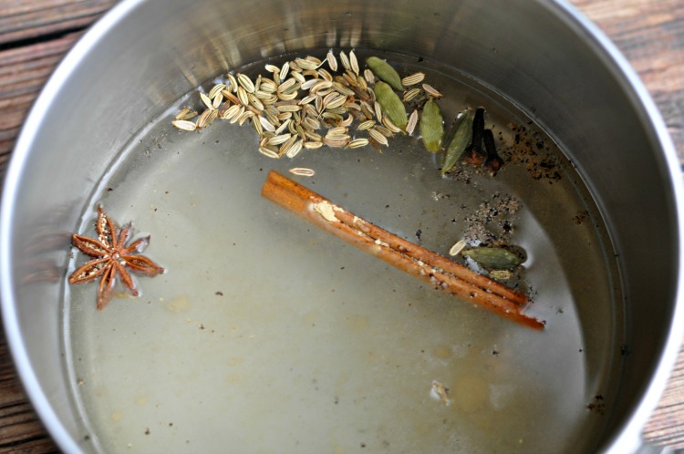 Chai spices simmering in water