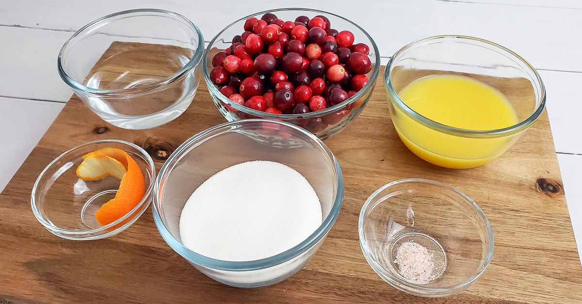 Ingredients to make cranberry sauce: Water, fresh cranberries, orange juice, orange peel, sugar and salt.