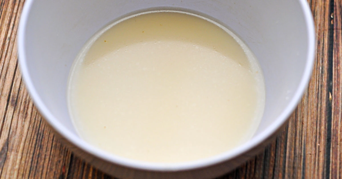 Cornstarch slurry in white bowl.
