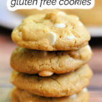 Stack of gluten free white chocolate macadamia nut cookies on a table