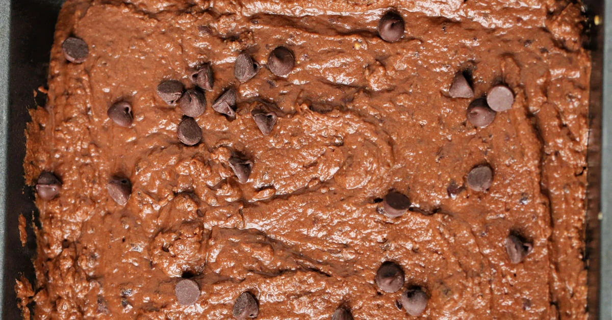 Black bean brownie batter sprinkled with chocolate chips.
