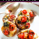 Five caprese stuffed mushrooms on a white plate with brown edge