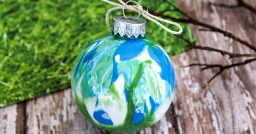 Homemade blue, white and green paint swirl ornament.