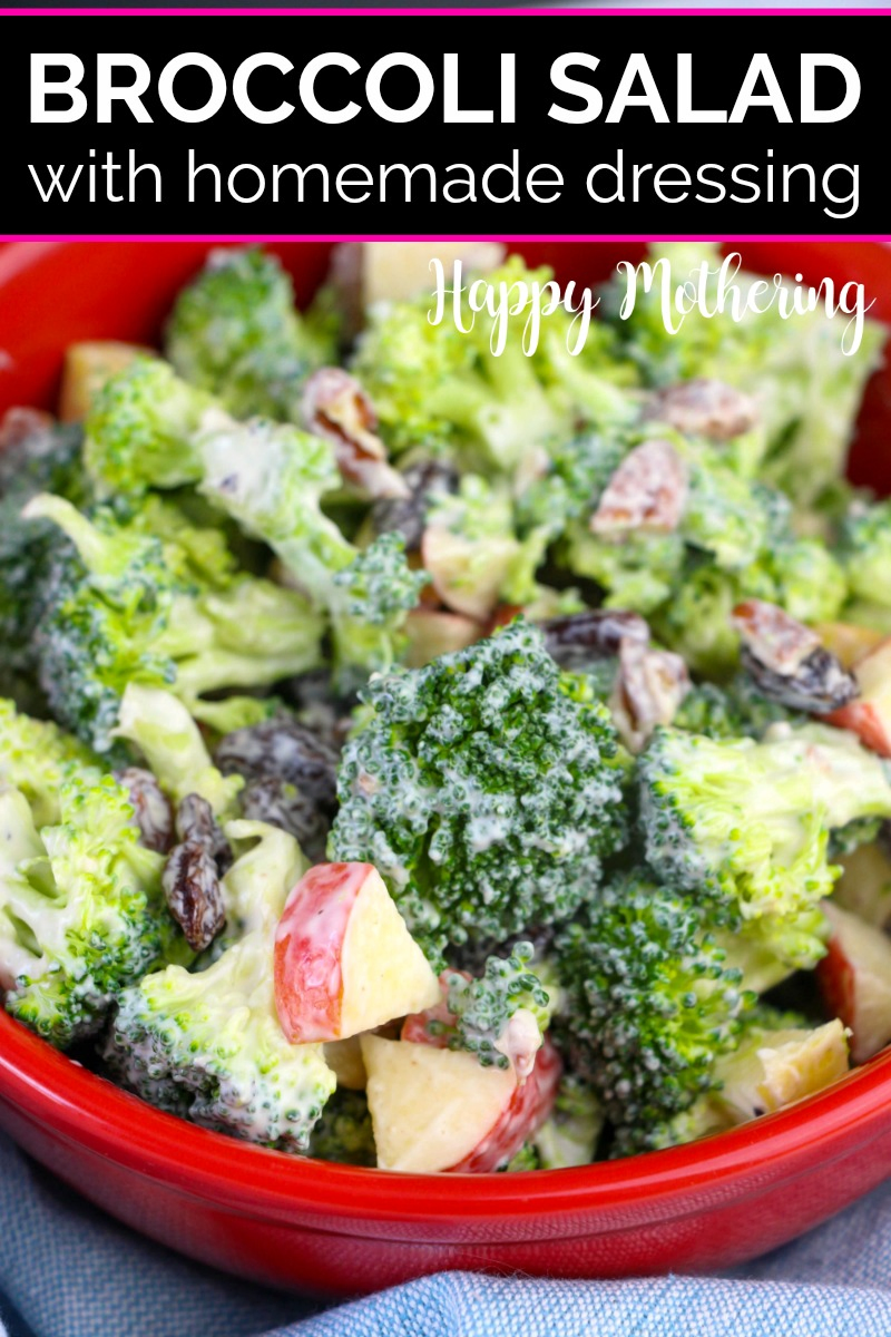 Close up of homemade broccoli salad with creamy dressing in a red bowl
