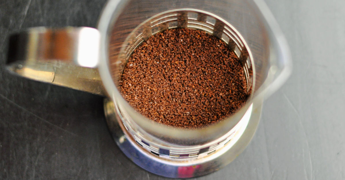 Coffee grounds in bottom of French press.