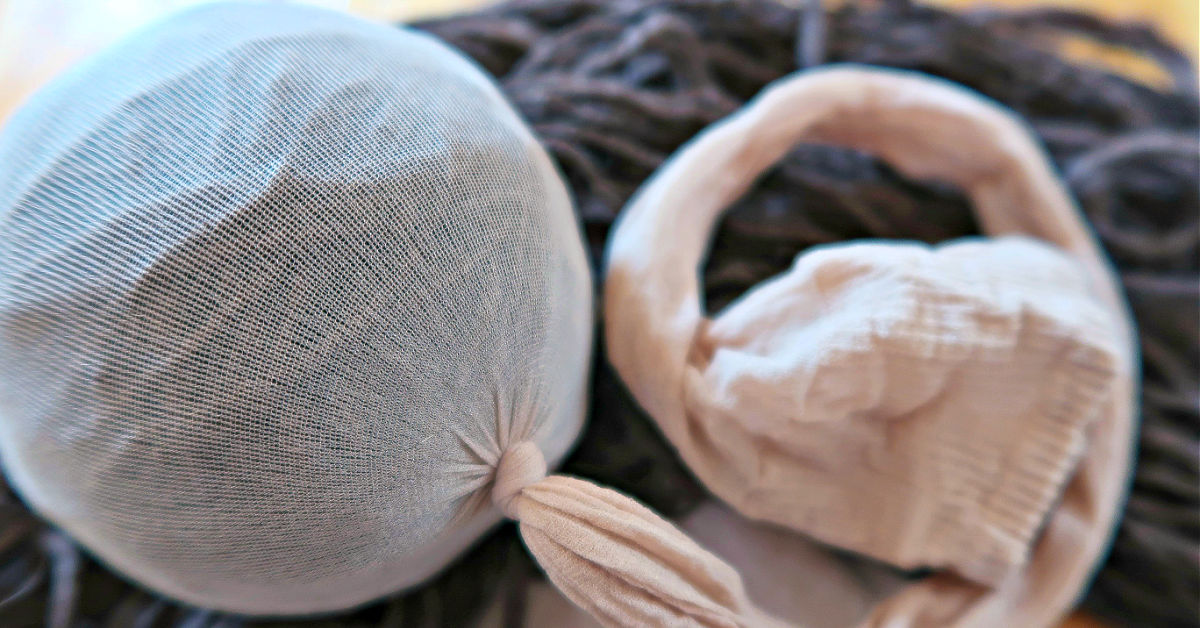 One wool dryer ball tied into the end of nylons