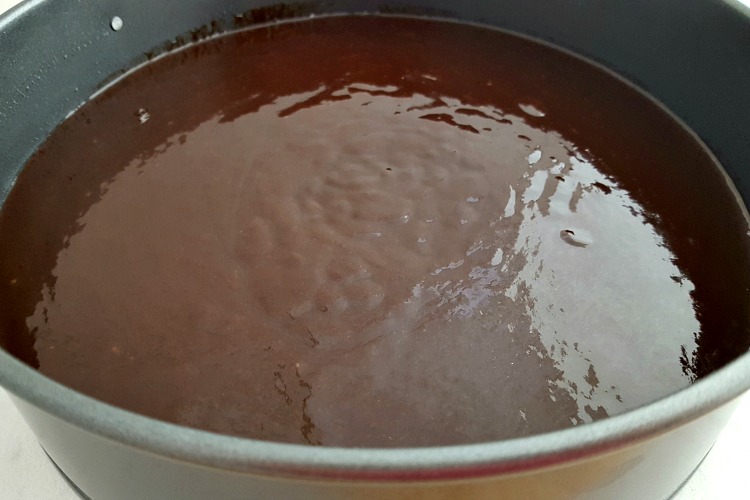 Batter for making a flourless chocolate torte in a springform pan.