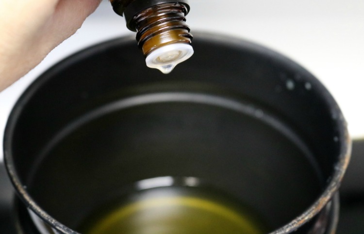 Adding essential oil to a double boiler