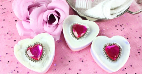Finished Valentine's Day Ring soap bars on a pink table setting.