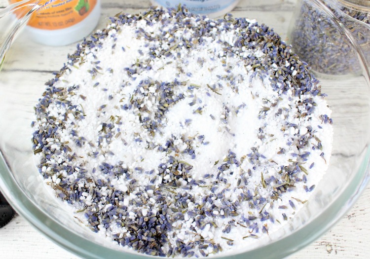 Ingredients for lavender bath slats in a glass mixing bowl