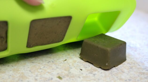 Popping the matcha green tea soap bars out of the silicone mold