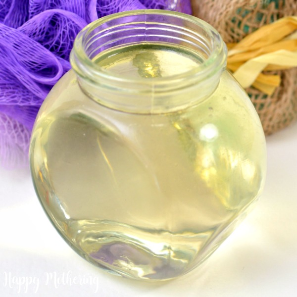 Close up of apple cider vinegar hair rinse with essential oils in a jar