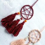 Two DIY dream catcher pendants on a white background