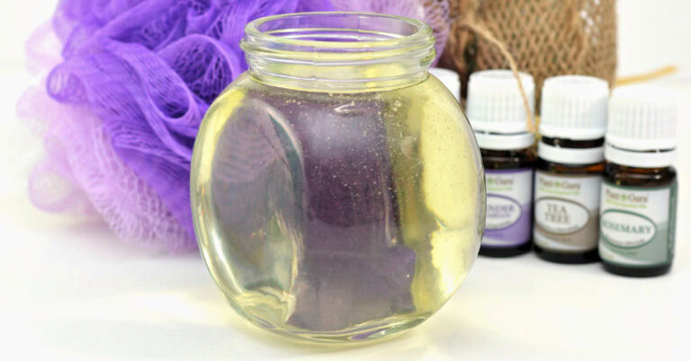 Glass jar of homemade apple cider vinegar hair rinse.