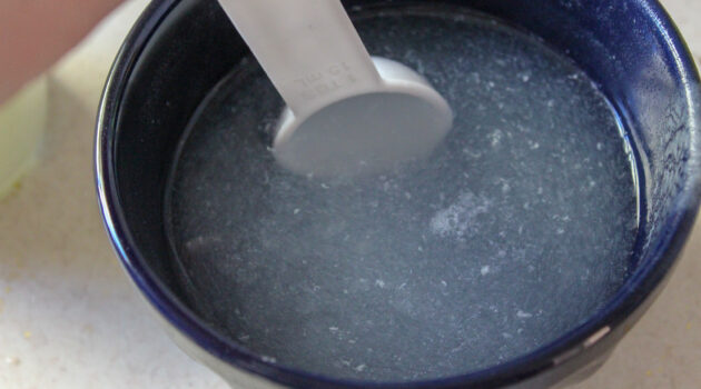 Get the rest of the baking soda out of the bottom of the bowl with the rest of the water