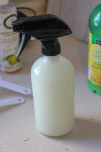 Lid secured on spray bottle of homemade degreasing cleaner