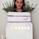Zoe as a mason jar vase full of lavender flowers for Halloween in a DIY costume