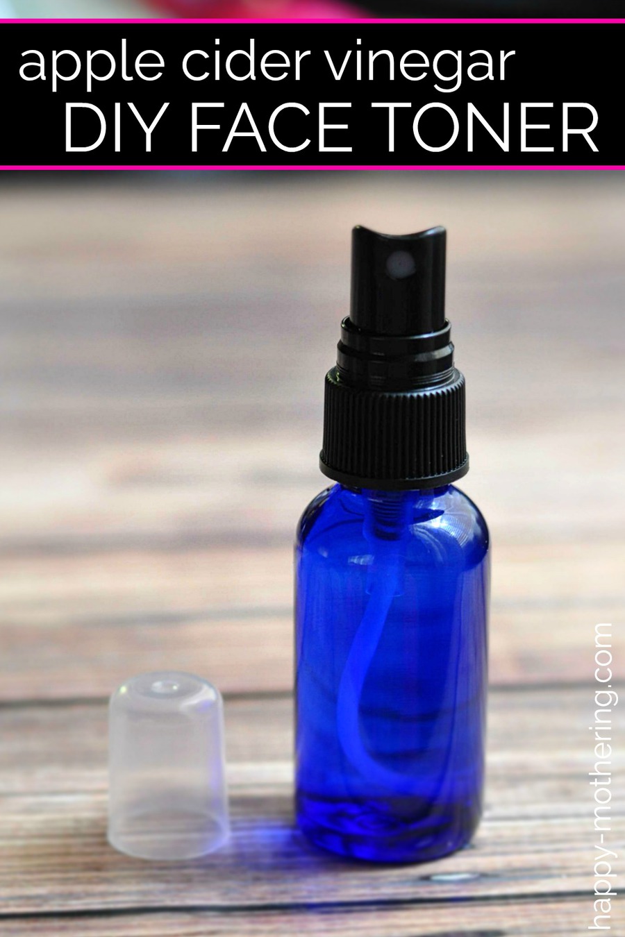 Blue spray bottle of homemade face toner on wood table