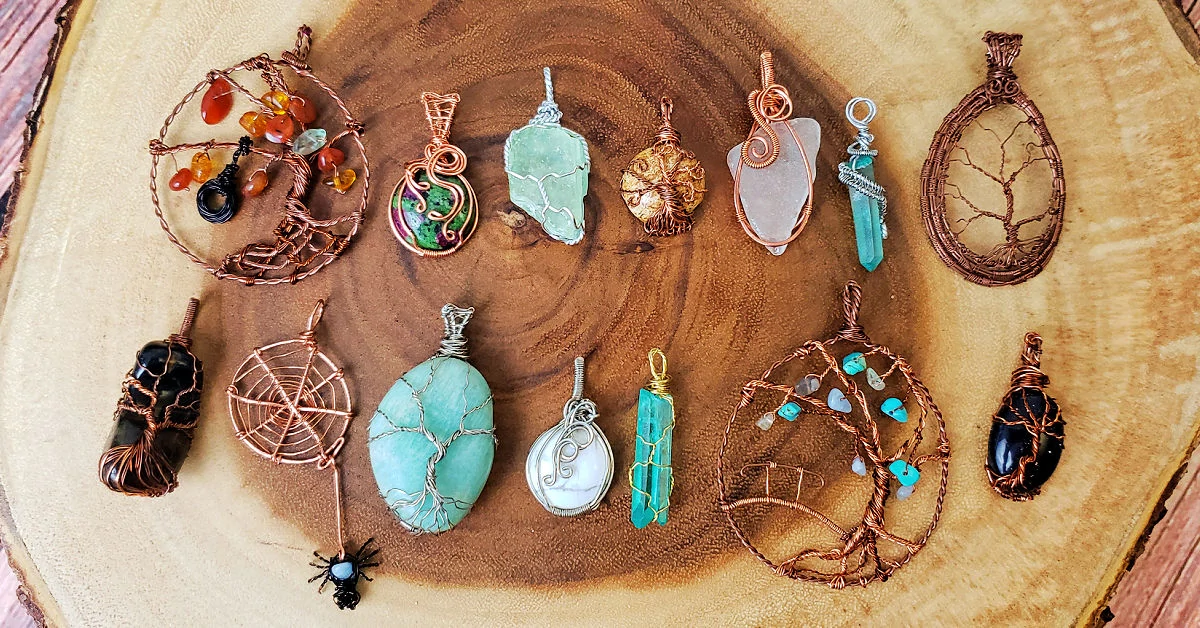 Several wire wrapped crystal and sea glass pendants by Zoe.