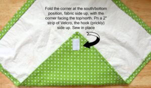 Sew a velcro strip prickly size up on the underside of the bottom corner.