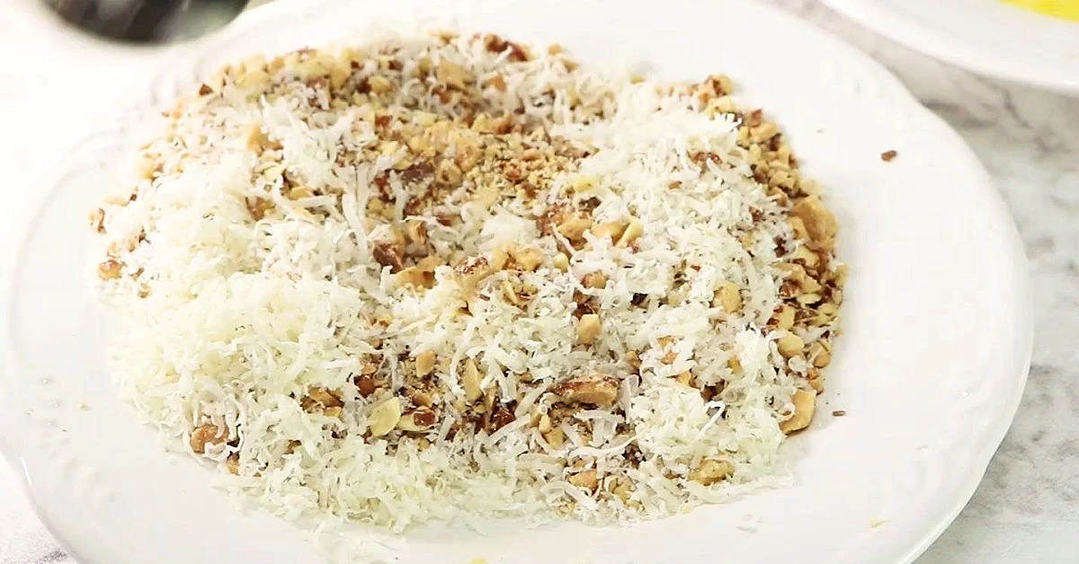 Crushed almond and grated Parmesan mixed up on a plate.
