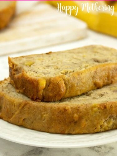 Two slices of moist, gluten free banana bread ready to eat on a dessert plate